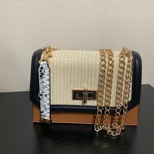 Aldo black and tan raffia purse